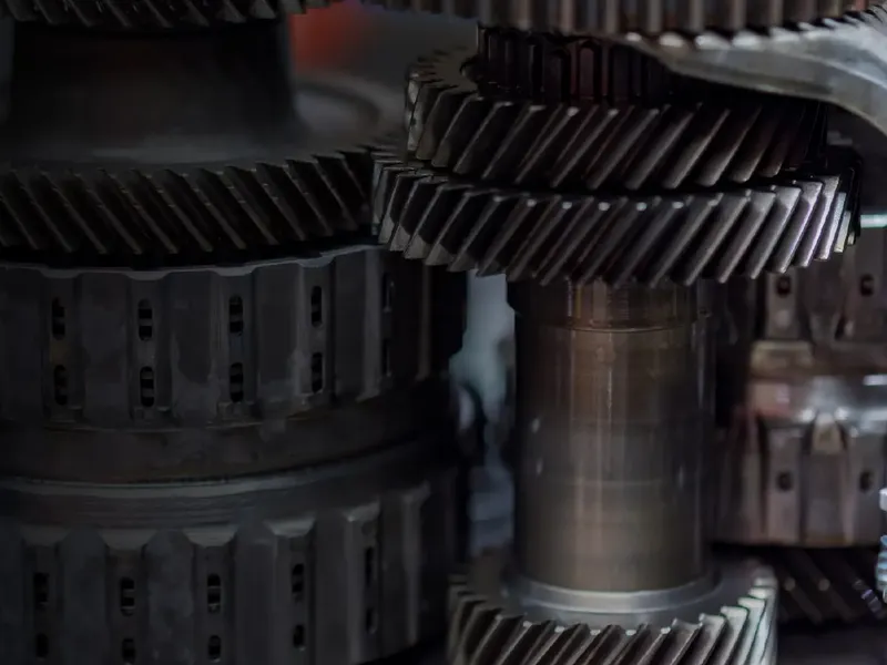 Close view of a helical gear train on the shop floor