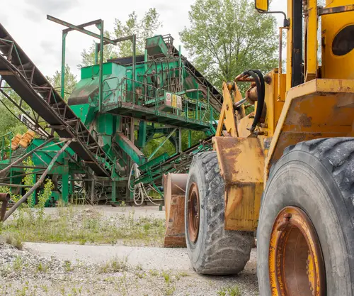 Earth moving excavation equipment at a gravel plant